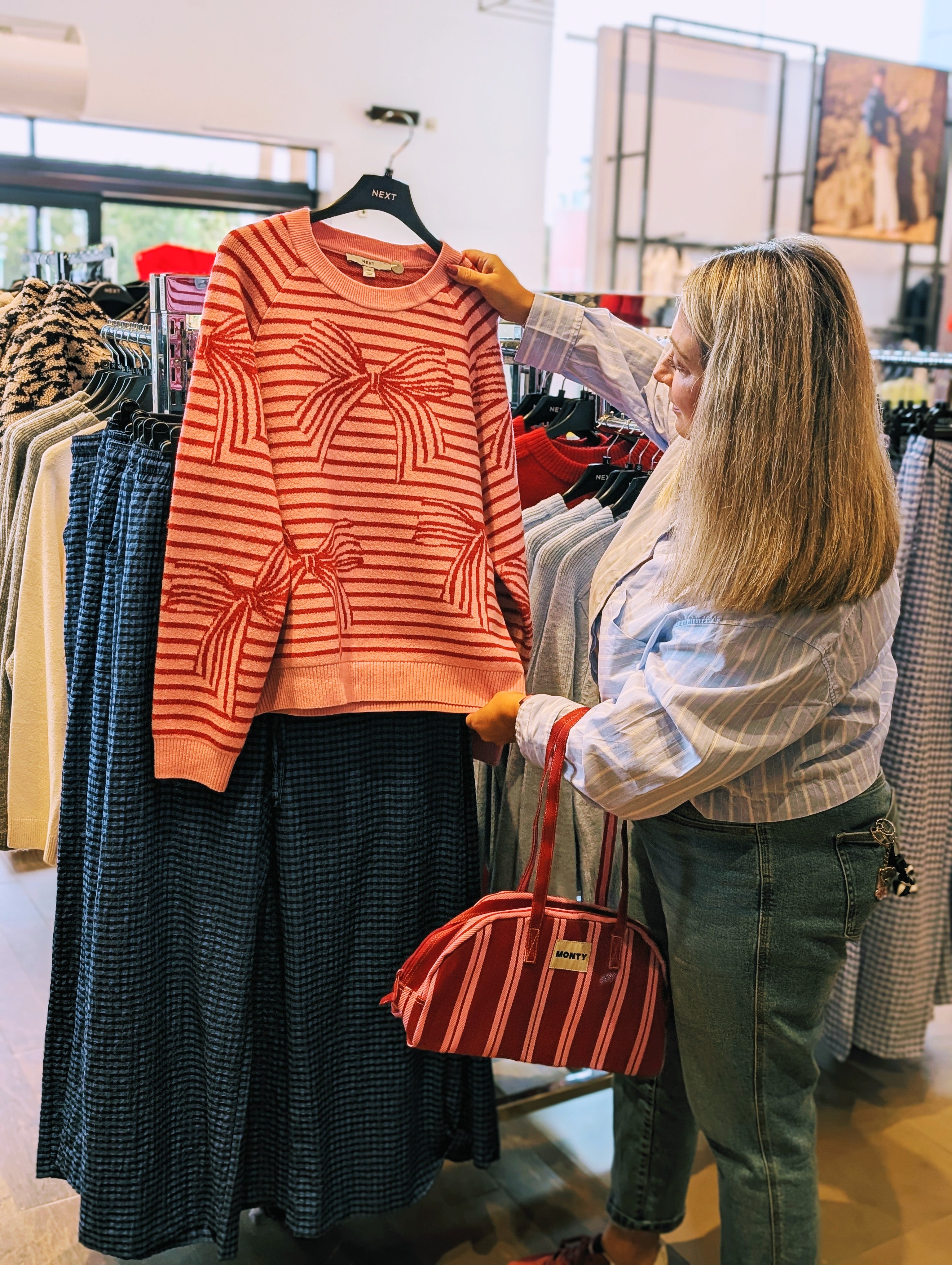 Hazel planning outfits in-store to suit a client’s body shape and personal style.