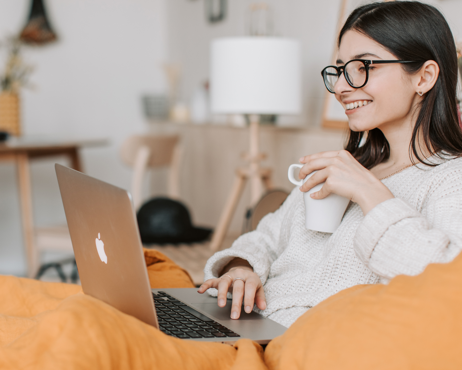 Client at home using laptop during online personal shopping session with Hazel