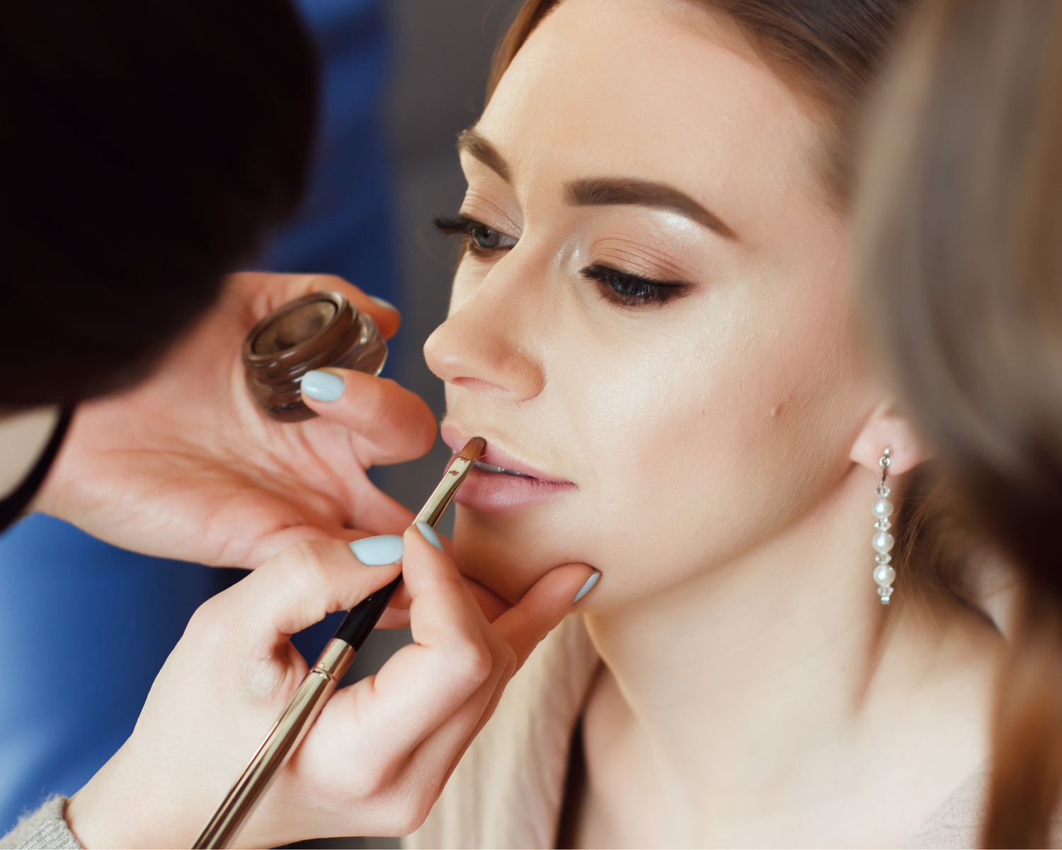 Personal stylist Hazel creating hairstyle and makeup look for occasion